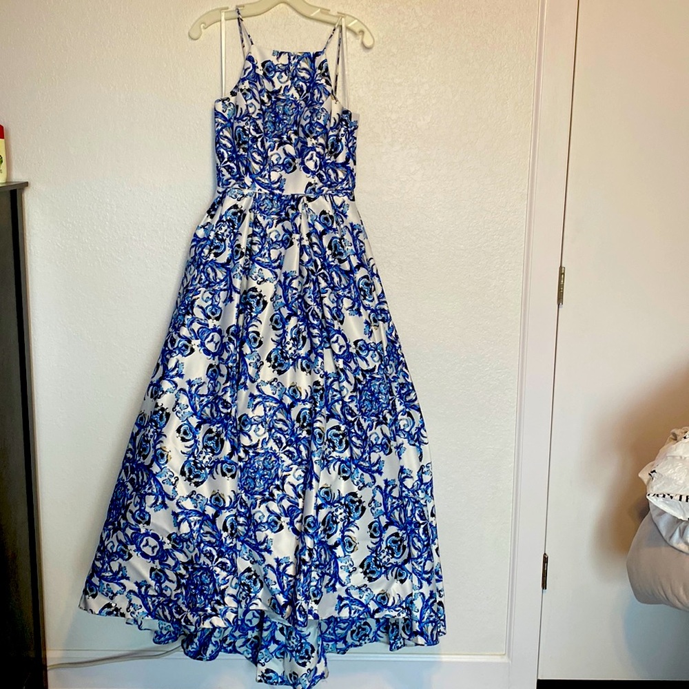 Betsy and Adam brand. Size 8. Blue and White prom dress with pockets. Worn once.